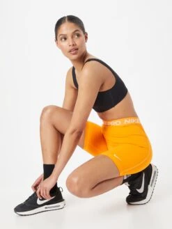 Nike Shorts Skinny Sportbroek Dames Neonoranje -Hummel Winkel fbb83726f5cdd59561a12d611d3fb87d
